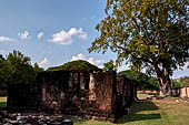 Thailand - Old Sukhothai - Wat Si Sawai. Remains of the laterite walls of a secondary vihan.   